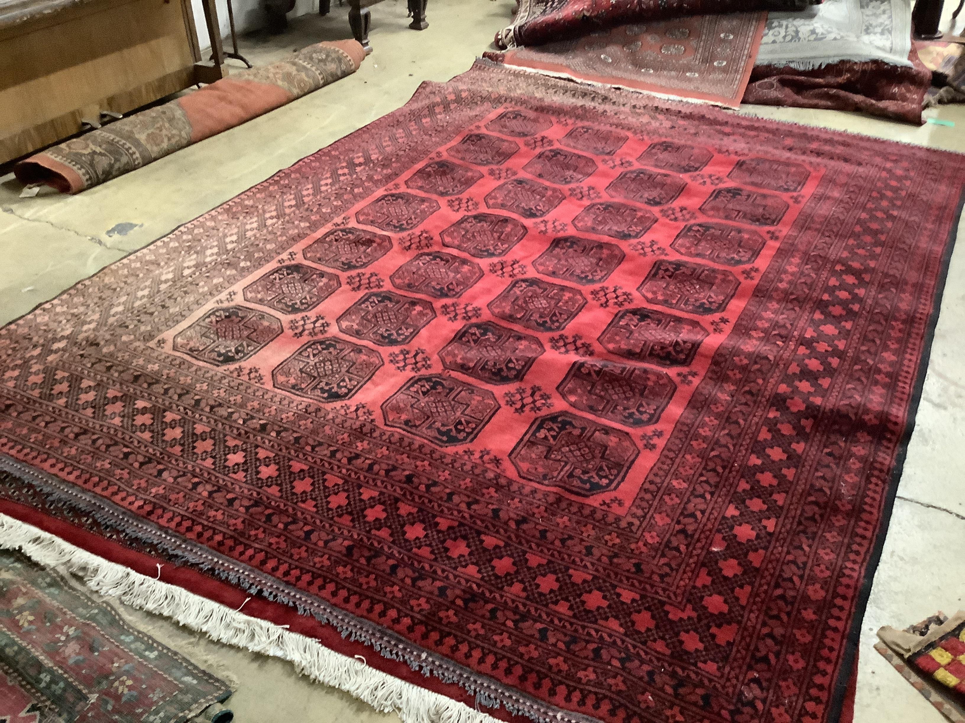 A Bokhara red ground carpet, 337 x 248cm